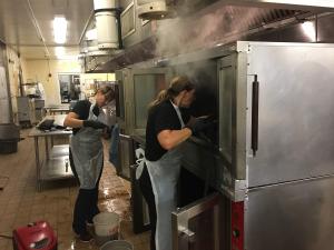 Kitchen Deep Cleaning Services for High-Security Facilities Expand Across Maryland, Washington DC, Virginia, and NC 22 Kitchen steam cleaning in progress, addressing grease buildup behind commercial cooking equipment in a regulated facility.