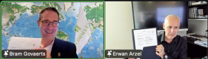 Screenshot of Bram Govaerts from CIMMYT and Erwan Arzel from KAUST holding signed documents during a virtual Memorandum of Understanding signing ceremony