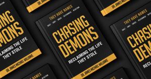 Book cover of Chasing Demons: Reclaiming The Life They Stole by Dr. James Michael Williams, featuring a black background with gold typography and the subtitle emphasizing reclaiming a stolen life.