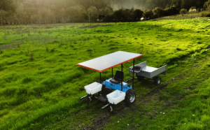 The e2T with a solar panel works on a California farm