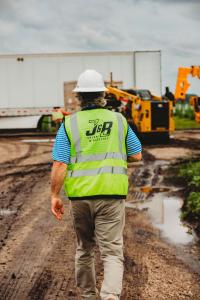 Solar construction worker off loading solar panels on a utiltiy scale solar project in Michigan