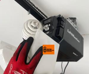 Close-up of a LiftMaster garage door opener being serviced by a Next Hour technician for peak performance.