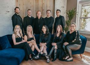 The REMAX Hendriks Team Realty staff standing collaboratively outside their local office in Niagara.