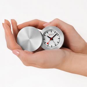 MONDAINE Travel Alarm Clock – compact Swiss-designed folding alarm clock with the iconic MONDAINE dial, ideal for travel and bedside use.