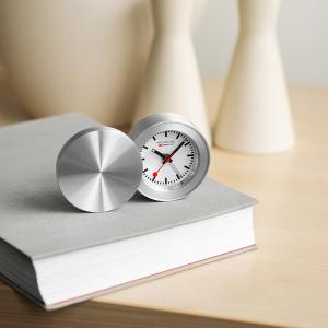 MONDAINE Travel Alarm Clock – compact Swiss-designed folding alarm clock with the iconic MONDAINE dial, ideal for travel and bedside use.