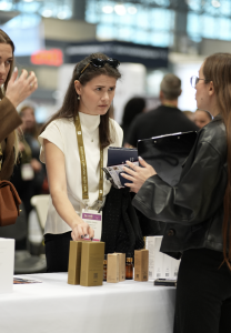 Woman speaking to guests at an expo