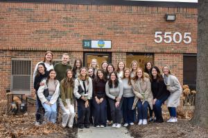 A group of CST Academy staff members celebrating the opening of the Park Ridge location.