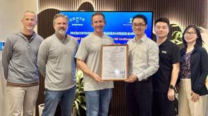 A photgraph of 6 people showing Jeff Laborde, President of Centr, receiving SGS certification from Anson Luo, Cybersecurity Director, Connectivity, SGS, joined by representatives from both organizations