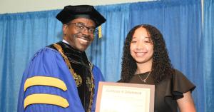 ASU President, Dr. Robert O. Scott Congratulates Student