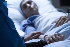 photo of a dying patient laying in bed