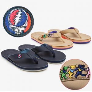 Photo features men's navy 'Reverb' sandal with Grateful Dead 'Stealie' patch on strap, and women's tan 'Daydreamer' sandal with Grateful Dead 'Dancing Bears' patch on strap.