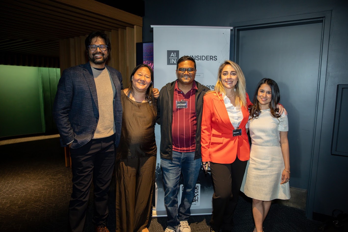 A group of five people standing together in front of an AI Insiders banner at the Cybersecurity event in San Francisco.