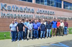 The photo is the TMC Technologies NASA IV&V team standing infront of the Katherine Johnson Independent Verification and Validation (IV&V) Facility, is the home of NASA’s IV&V Program