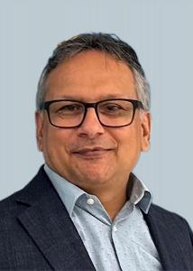 Image shows a headshot of Dr. Dilip Bhandari.