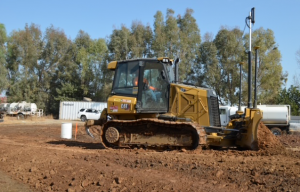 Denny McCowan General Engineering Inc. using GPS-guided machinery for precise site grading and sub-base preparation in the Central Valley.