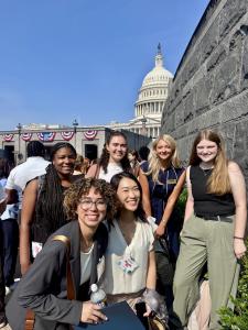 A group of young people stand in front of the Capitol dome before meeting with Congressional offices to advocate for anti-hunger legislation.