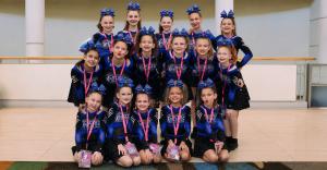 The Cheer Athletics Omaha Courage CAts, a Youth Level 1 all star cheer team, before competing at the AAU Junior Olympic Games.