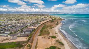 Aerial view of Kekainani at Hoakalei on Oʻahu showing newly released ocean-view homesites along the Pacific coastline and the surrounding residential community.