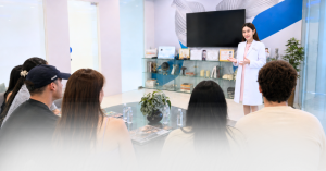R3 Life physician presenting to international travel creators during a TAT Los Angeles wellness visit in Bangkok