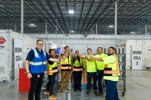 Samsar technicians celebrate remanufacturing their 1,000th Nissan Leaf pack, seen here just prior to disassembly.