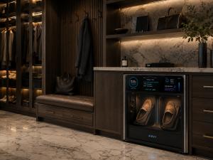 AiRET AX1 built into dark wood entryway cabinetry with marble countertop, holding a pair of loafers
