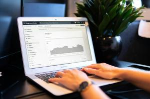 Person typing on a laptop showing a Google Search Console report