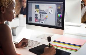 The Future of Graphic Design: Trends to Watch 4 A graphic designer using their tablet to work on a project.