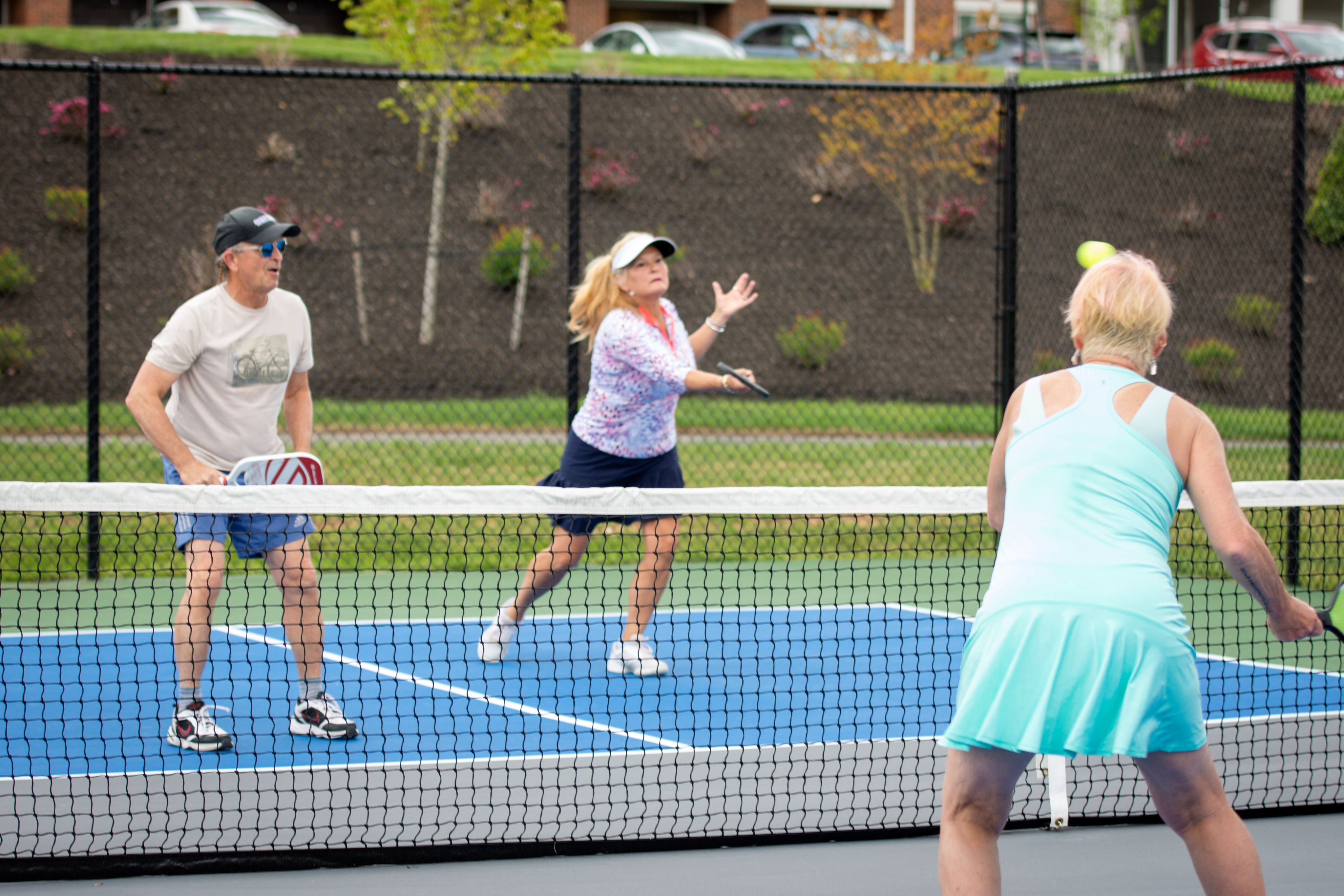 Members enjoy on-site pickleball courts