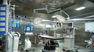  A modern neurosurgery operating room at Dr. Rao's Hospital, equipped with surgical microscopes, neuronavigation systems, and high-resolution monitors for precision surgeries.