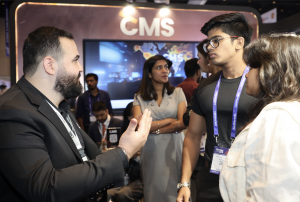 A CMS Prime representative engaging with traders and investors at Booth #3 during Money Expo India 2025, reflecting the company’s client-first approach."